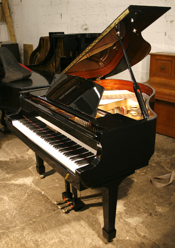 Brand new, Steinhoven Model 148 baby grand piano with a black case and polyester finish. Piano has an eighty-eight note keyboard and a three-pedal piano lyre.