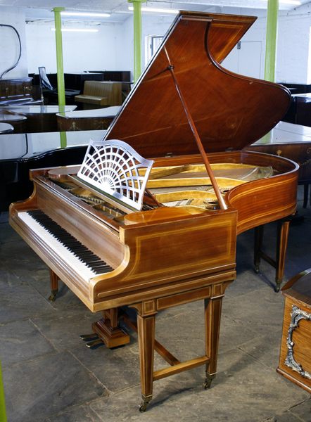 Inlaid,  1884, Bechstein Model B grand piano with a mahogany case and gate legs. Piano has an eighty-eight note keyboard and a two-pedal lyre