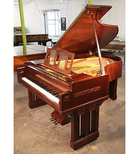 A 1916, German Arts and Crafts, Ibach Grand Piano with a Mahogany Case and Carved Panel Detail. Piano Cheeks Feature Square Cut Indents. Music Desk Features Twisted Brass Spindles.  Designed by Dutch Architect Pierre Joseph Hubert Cuypers