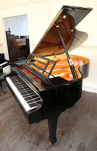 Brand new, Feurich Model 178 Professional grand piano with a black case and brass fittings.  Piano has an eighty-eight note keyboard and a three-pedal piano lyre. 