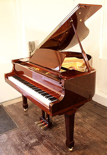 Brand new, Steinhoven Model 148 baby grand piano with a mahogany case and polyester finish. Piano has an eighty-eight note keyboard and a three-pedal piano lyre.