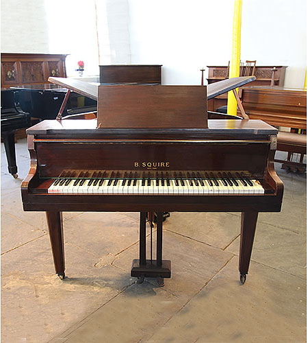  A 1939, Squire butterfly baby grand piano with a mahogany case. Piano has an seventy-three note keyboard and a two-pedal piano lyre.