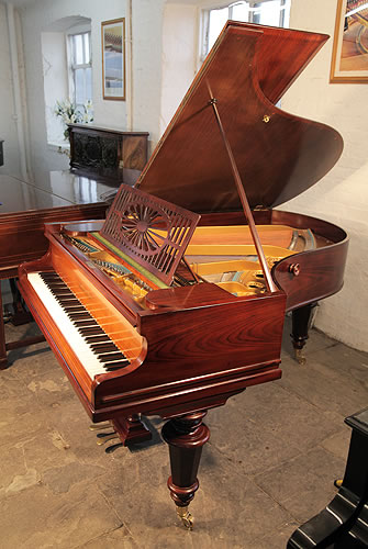 Restored, Bechstein Model A grand piano with a polished, rosewood case and turned legs.