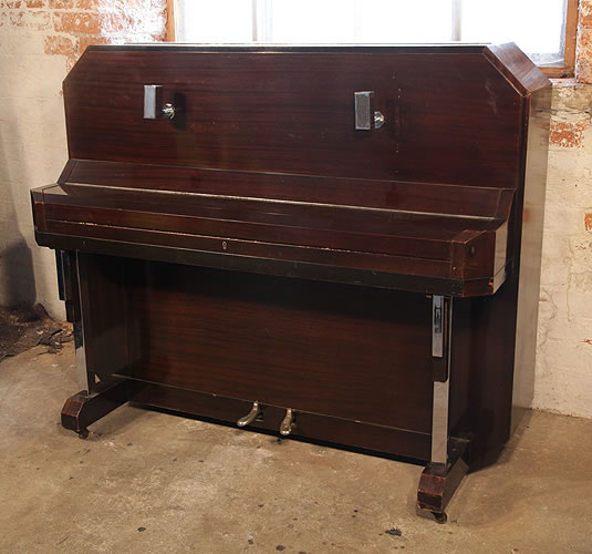 A Barker upright piano with an Art Deco style, mahogany case. Cabinet features strong angular styling and chrome fittings