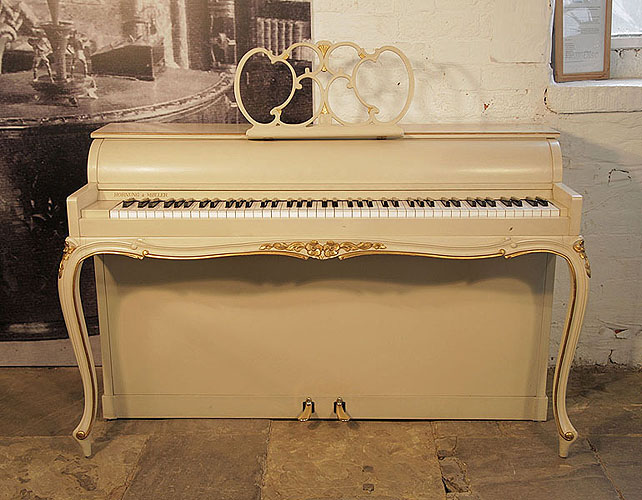 A 1968, Hornung and Moller upright piano with a Louis XV  style case with gilt ornament  and cabriole legs.Piano has an eighty-five note keyboard and two pedals. 