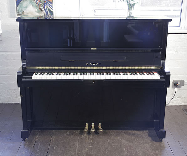 Piano for sale. A 1991, Kawai SU-2L upright piano with a black case and polyester finish
