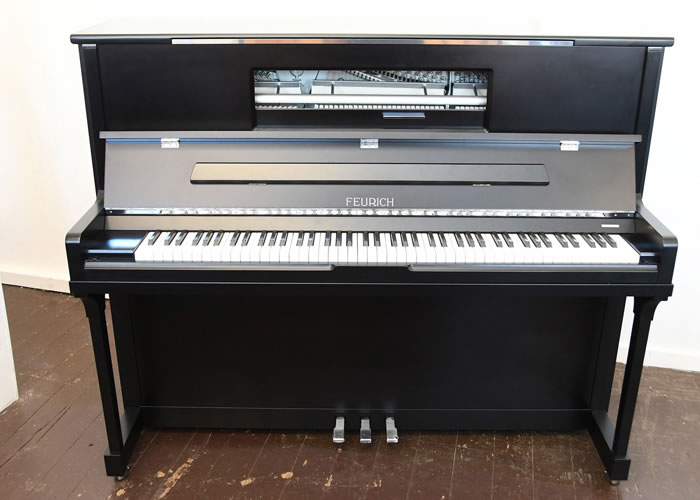 Brand new, Feurich Model 123 upright piano with a satin, black case, LED Lighting and chrome fittings