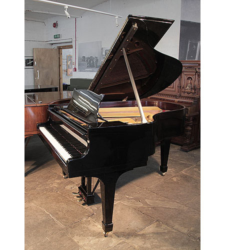  Restored, 1936, Steinway Model M grand piano for sale with a black case and spade legs. Piano has an eighty-eight note keyboard and a two-pedal lyre.