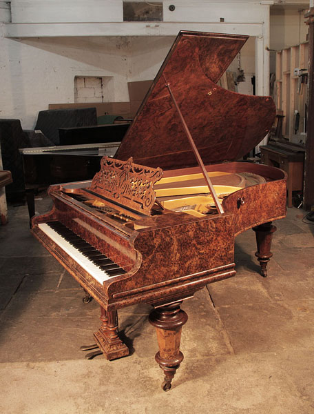 Antique, 1898, Bechstein model V grand piano for sale with a burr walnut case and turned, faceted legs.  Piano has an eighty-eight note keyboard and a two-pedal lyre. 