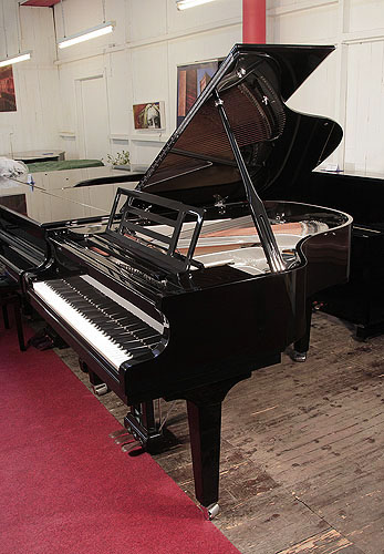 Brand new, Feurich Model 179 Dynamic II grand piano with a black case, openwork music desk and gun metal frame. Piano music desk features an adjustable LED strip light. Piano has an eighty-eight note keyboard and a three-pedal piano lyre. 