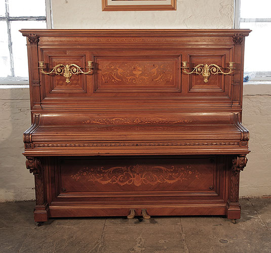 Albert Gast upright piano for sale with a quartered, walnut case. Entire cabinet inlaid in Neoclassical designs featuring scrolling acanthus, urns and flowers. Piano has an eighty-eight keyboard and two pedals. 