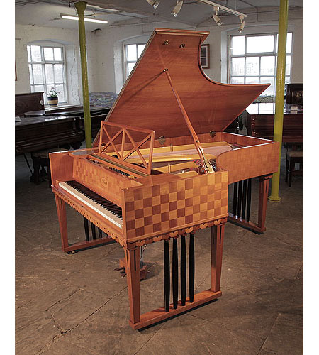 Restored, 1907 Ibach Model 2 grand piano with a cherry case in a checkerboard design. Piano has square, gate legs with four contrasting black spindles. Designed by Emanuel von Seidl. Piano one of two designed for and offered to Richard Strauss.