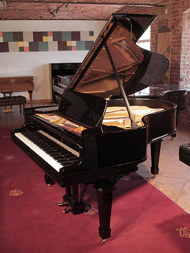 Rebuilt 1905, Steinway Model O grand piano with a with a black case and brass fittings. Piano has been rebuilt in Germany by Steinway Academy trained technicians using 100% Steinway parts. Piano has an eighty-eight note keyboard and a two-pedal lyre.   