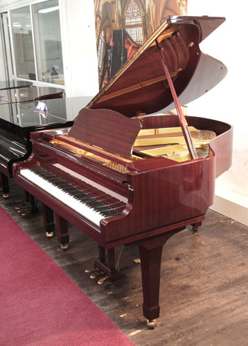 Reconditioned, 1989, Yamaha G1 baby grand piano with a mahogany case and spade legs. Piano has an eighty-eight note keyboard and a three-pedal lyre.  