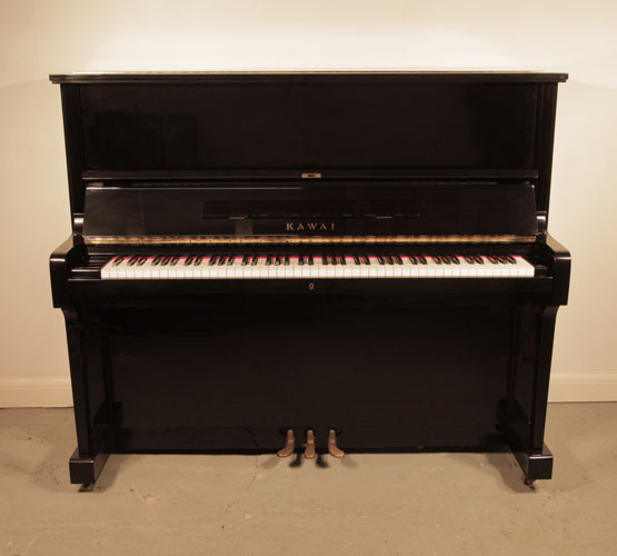 Piano for sale. Reconditioned, 1973, Kawai BL-51 upright piano with a black case and polyester finish. Piano has an eighty-eight note keyboard and three pedals. 