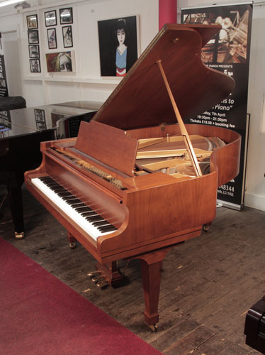 Reconditioned, 1978, Kawai KG-2C grand piano for sale with a polished, walnut case and spade legs. Piano has an eighty-eight note keyboard and a three-pedal lyre