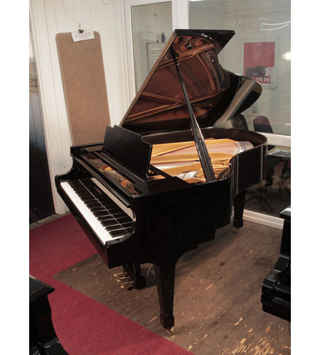 Reconditioned, 1976, Kawai KG-2C grand piano for sale with a black case and spade legs.  Piano has an eighty-eight note keyboard and a three-pedal lyre. 