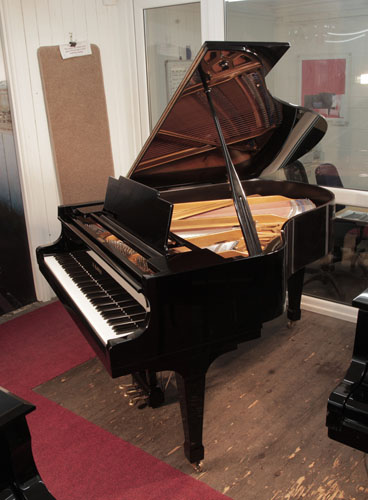 Reconditioned, 1976, Kawai KG-2C grand piano for sale with a black case and spade legs. Piano has an eighty-eight note keyboard and a three-pedal lyre