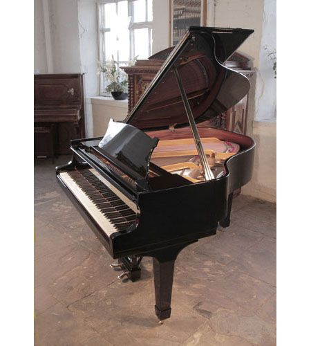 Rebuilt, 1937, Steinway Model S baby grand piano with a black case and spade legs. Piano has an eighty-eight note keyboard and a two-pedal lyre.
