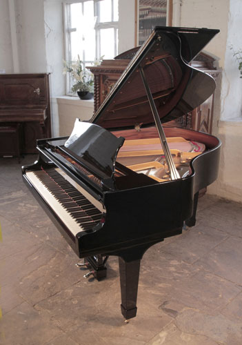 Rebuilt, 1937, Steinway Model S baby grand piano with a black case and spade legs. Piano has an eighty-eight note keyboard and a two-pedal lyre. 