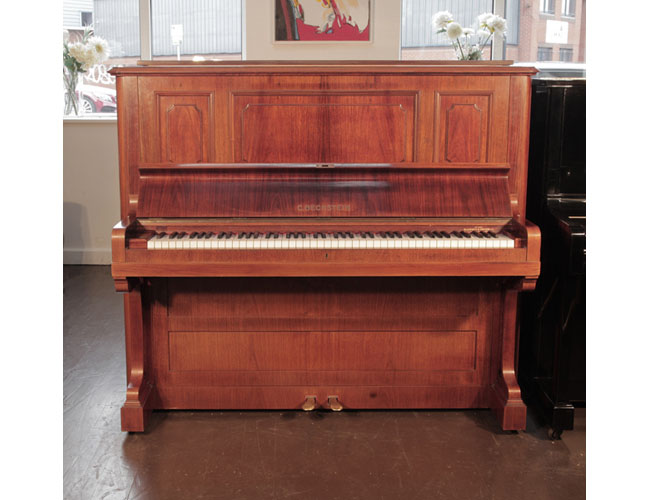Reconditioned, 1924, Bechstein model 8 upright piano with a rosewood case and brass fittings. Piano has an eighty-eight note keyboard and two pedals. 