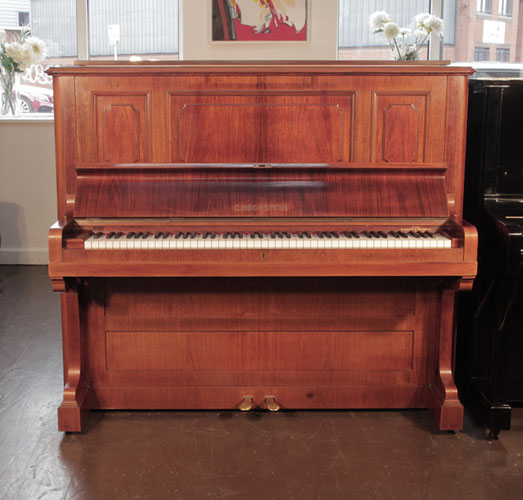 Reconditioned,  1924, Bechstein model 8 upright piano with a rosewood case and brass fittings. Piano has an eighty-eight note keyboard and two pedals. 