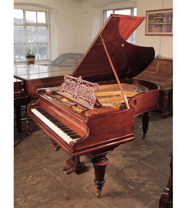 Antique, 1899, Bechstein Model V grand piano for sale with a rosewood case and turned, faceted legs. Music is in a cut-out design of stylised swags, tendrils and a central anthemion. Piano has an eighty-eight note keyboard and a two-pedal lyre. 