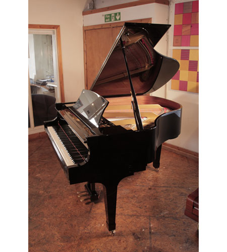 Reconditioned, 2009,  Boston GP156 II baby grand piano with a black gloss case and spade legs. Piano has an eighty-eight note keyboard and a three-pedal lyre.