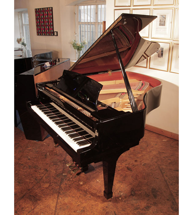 Reconditioned, 1993, Boston GP178 grand piano for sale with a black case and spade legs. Piano has an eighty-eight note keyboard and a three-pedal lyre. 