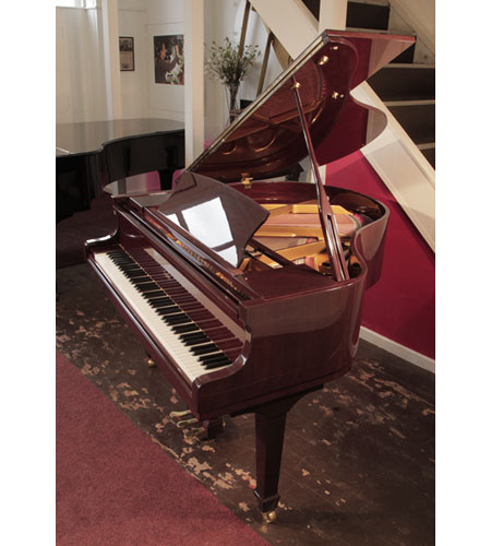 Reconditioned, 2007, Challen GP142 baby grand piano for sale with a mahogany gloss case.  Piano has an eighty-eight note keyboard and a three-pedal lyre.
