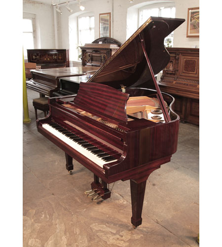 Reconditioned,  1986, Kawai KG-1D baby grand piano with a mahogany case and spade legs. Piano has an eighty-eight note keyboard and a three-pedal lyre.