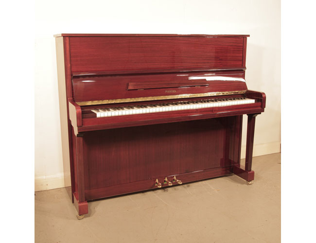Reconditioned, 2000, Pianova upright piano with a mahogany case and brass fittings. Piano has an eighty-eight note keyboard and three pedals. 