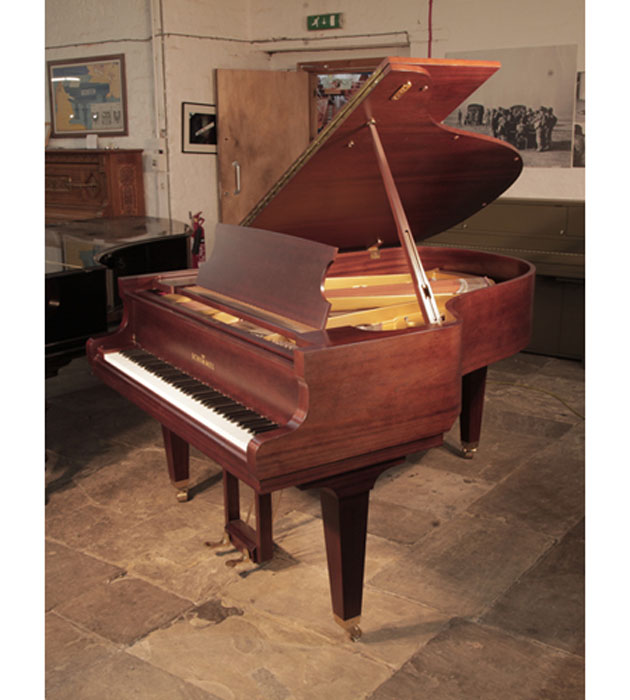 Reconditioned, 1987, Schimmel grand piano for sale with a mahogany case and square, tapered legs 