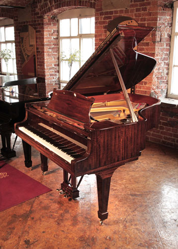 Reconditioned, 1975, Steinway Model A grand piano for sale with a  tiger mahogany case spade legs. Piano has an eighty-eight note keyboard and a three-pedal lyre