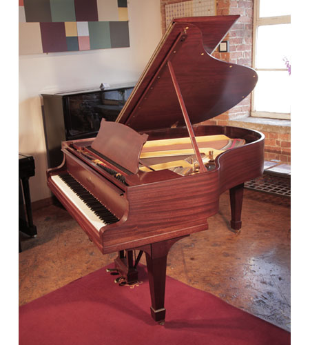 Rebuilt, 1929, Steinway Model M grand piano for sale with a satin, mahogany case and matching stool. Piano has an eighty-eight note keyboard and a two-pedal lyre.  