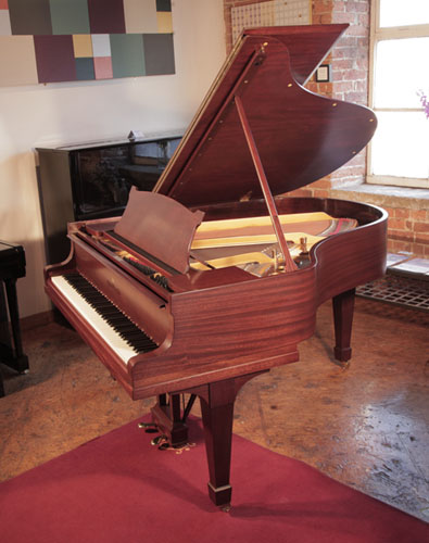 Rebuilt, 1929, Steinway Model M grand piano for sale with a satin,  mahogany case and matching stool. Piano has an eighty-eight note keyboard and a two-pedal lyre.  