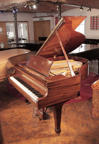 Rebuilt, 1937 Steinway Model S baby grand piano with a crown cut mahogany case and spade legs. Piano has an eighty-eight note keyboard and a two-pedal lyre. 