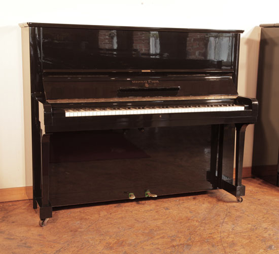 Reconditioned, 1939, Steinway Model V upright piano for sale with a black case and brass fittings. Piano has an eighty-eight note keyboard and two pedals  