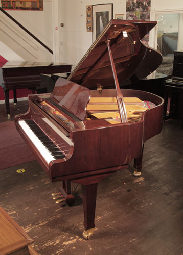 Reconditioned, 2008, Weber WLG-50 baby grand piano for sale with a walnut gloss case. Piano has an eighty-eight note keyboard and a three-pedal lyre. 