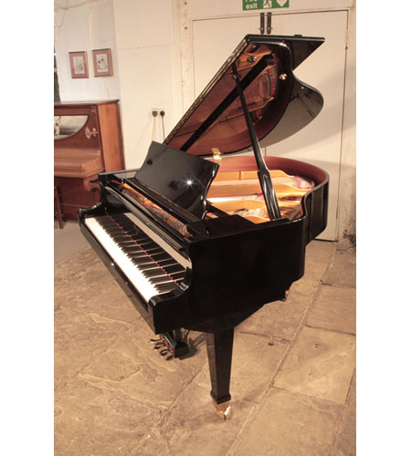 Reconditioned, 1988,  Weber WLG-50 baby grand piano with a   black  case and spade legs. Piano has an eighty-eight note keyboard and a three pedal lyre