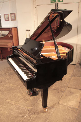 Reconditioned, 1988,  Weber WLG-50 baby grand piano with a   black  case and spade legs. Piano has an eighty-eight note keyboard and a three-pedal lyre. 