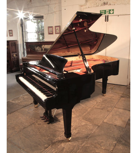 Reconditioned, 2008, Wendl and Lung Model 218 concert grand piano with a black case and polyester finish. The spade piano legs features dual casters.  Piano has an eighty-eight note keyboard and a three-pedal lyre