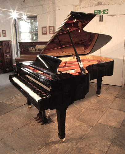 Reconditioned, 2008, Wendl and Lung Model 218 concert grand piano with a black case and polyester finish. Piano has an eighty-eight note keyboard and a three pedal lyre 