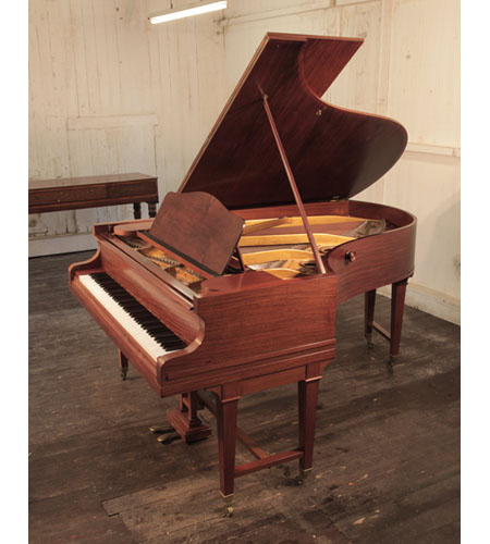 A 1920s, Bechstein Model B grand piano with a mahogany case and gate legs attached to a cross stretcher.