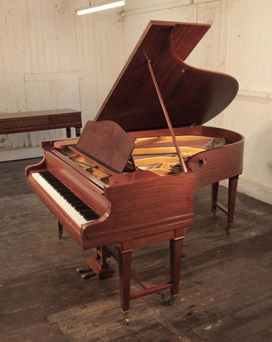 A 1920s, Bechstein Model B grand piano with a mahogany case and gate legs attached to a cross stretcher.