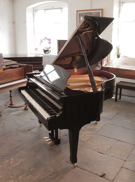 Reconditioned Carl Steinberg baby grand piano for sale with a black case and spade legs. Piano has an eighty-eight note keyboard and a three-pedal lyre.  