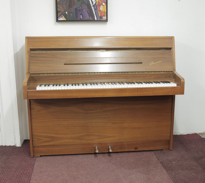 Pre-owned, 1970, Knight upright piano with a mahogany case and cut-out music desk. Piano has an eighty-eight note keyboard and two pedals.