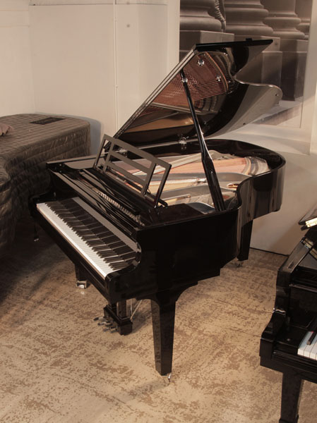 Brand new, Feurich Model 179 Dynamic II grand piano in black gloss with a gun metal frame. Piano music desk features an adjustable LED strip light. Piano has an eighty-eight note keyboard and a three-pedal piano lyre