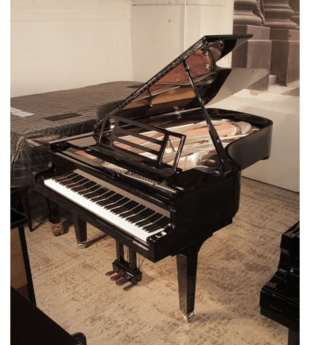 Brand new, Feurich model F218 Concert I grand piano with a black case and chrome fittings. Piano has a gunmetal frame.  Piano has an eighty-eight note keyboard and a three-pedal piano lyre. 