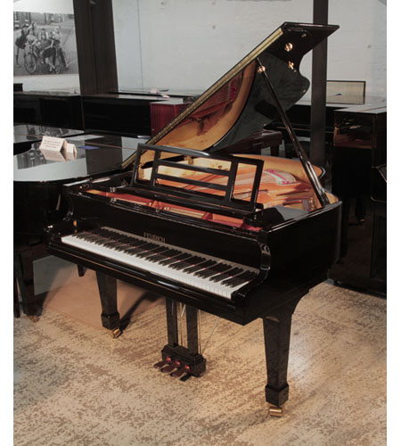 Reconditioned 2015, Feurich Model 161 Professional I baby grand piano with a black case and brass fittings. Piano has an eighty-eight note keyboard and a three-pedal lyre. 